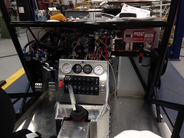 The switch & gauge panel mounts on the trans doghouse.  The actual digital dash panel will mount on the now removable FFR dash panel just behind the steering wheel.  The gauges on this panel are brake pressure front and rear and AFR for left and right.