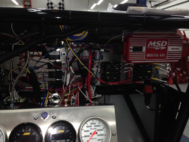 The fuse panels and relays mount to a removable backplane and were pre-wired prior to installation.  Then the switch and gauge wiring was terminated after the switch & gauge panel was fabricated.  The wiring is ~95% complete at this point and all done from scratch.
