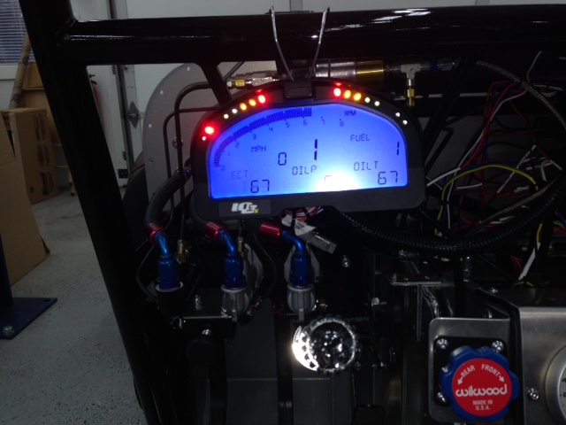 The RacePak IQ3s digital gauge display is wired and temporarily hung on the windshield bar.  It will reside on the removable FFR dash panel once the body is mounted.