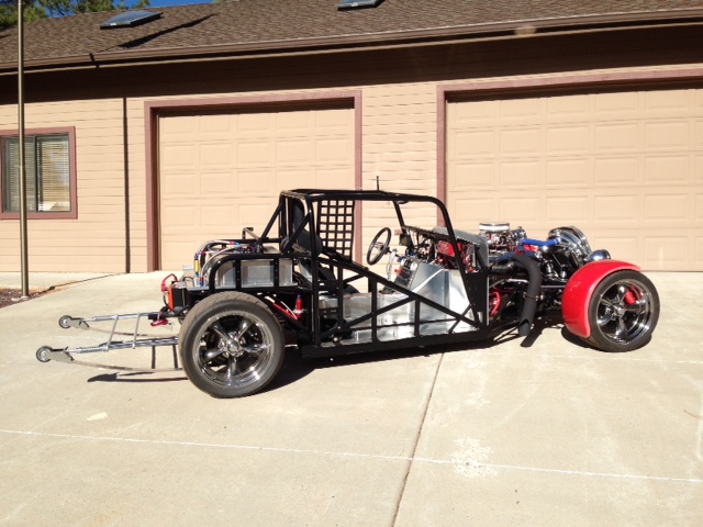 View of the completed roller without the body installed.  The body does not act as a stressed structure, even the doors and trunk hinges mount to the chassis.  The roller can be driven go-cart style without the body.  Extremely stiff and durable A513 Type-5 DOM, TIG welded mild steel chassis.