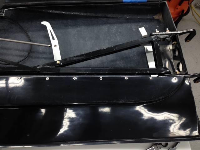 When I first built the roll cage I made sure I had clearance between the door bars and the inner door panels.  A year later and the body has moved (shrunk?) and I had an interference fit that wouldn't allow me to adjust the door.  So I had to remove a portion of the inner door skin.  If I was going to modify the door I was going to open it up to make access to the hinges and latch mechanisms easier.  Originally, the hinges were a pain to adjust and now I have easy access.  I can even remove the entire door hinge mechanism for paint without loosening the hinges and having to start over with the door alignment.