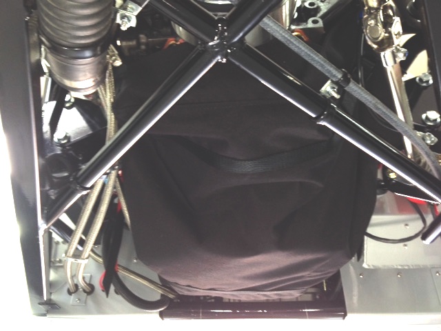 Engine diaper (NHRA required) to contain oil and shrapnel should the bottom end let go.  It contains an oil absorbent pad and will capture all the 7-quarts of oil and several gallons of coolant.