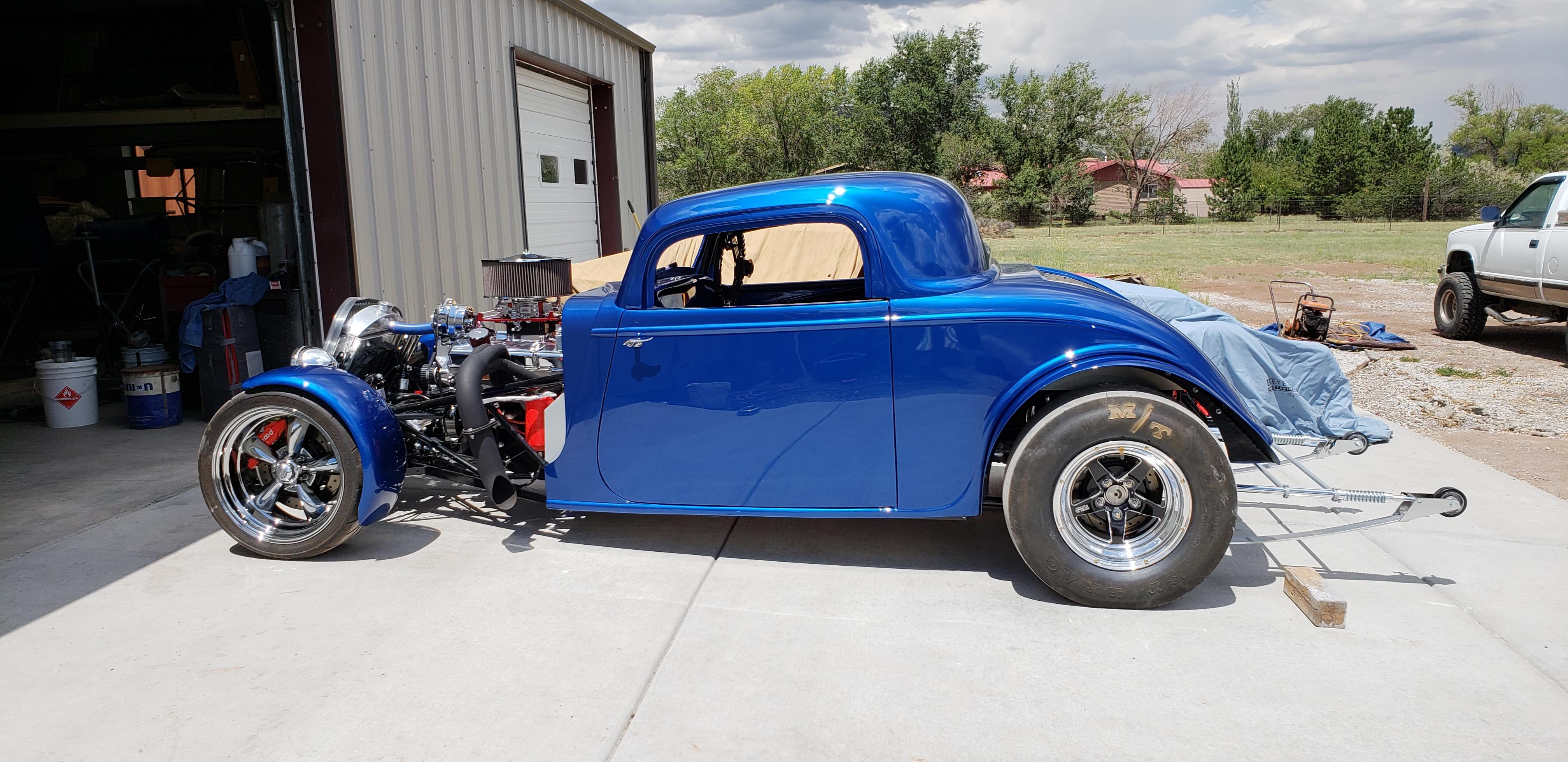 Drove over to the painter today to help install the body (last time I hope).  Pushed it outside to get a photo.  The painter still needs to cut and buff to remove any orange peal.  Once the painter is done I'll pick it up and start assembling all the parts that make this car whole.