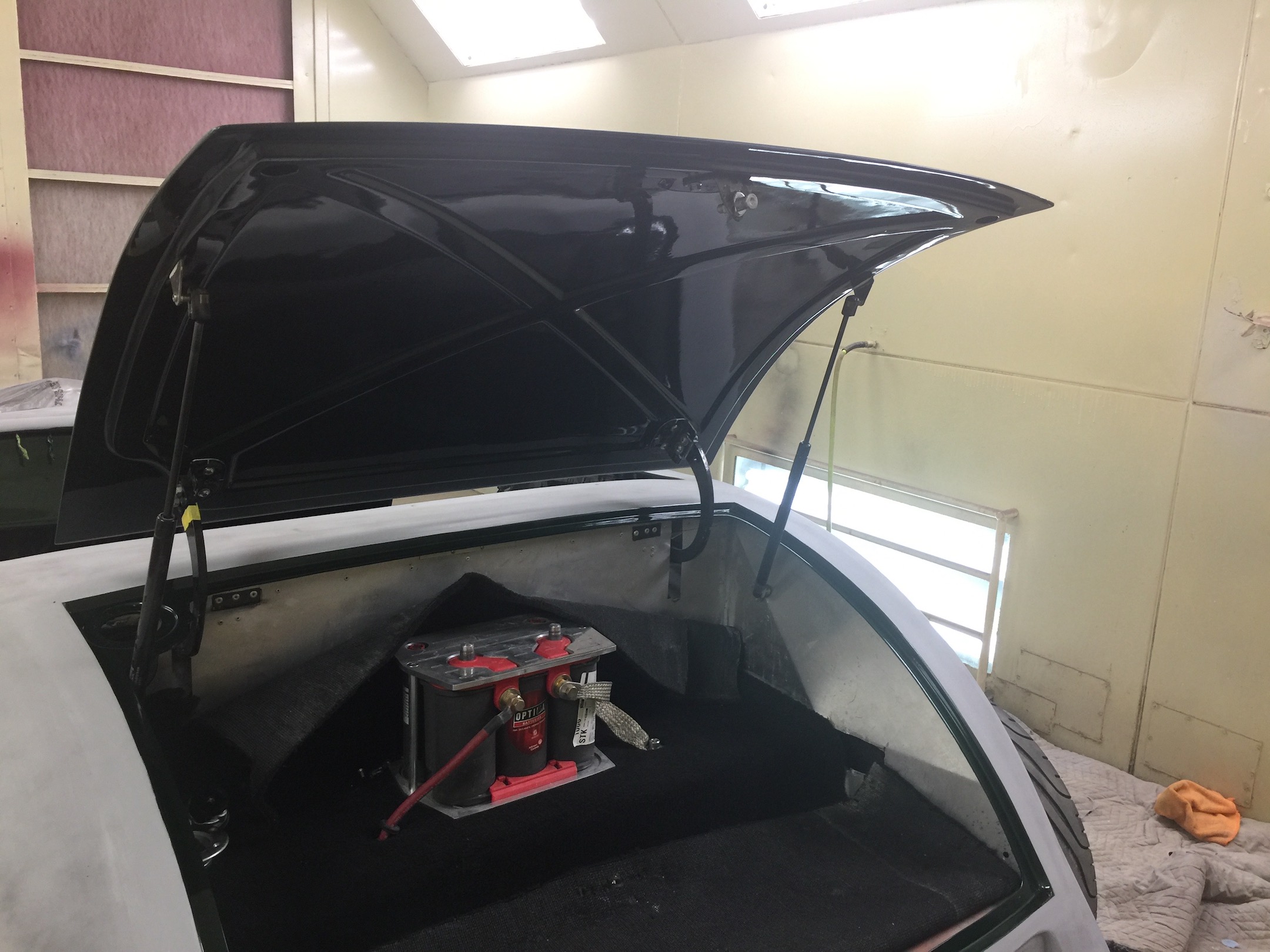 Kootenai Gas Shocks installed in Trunk. Fiberglass, Body, and Paint Prep, 121 Rod & Restoration. Jambing and Edging.