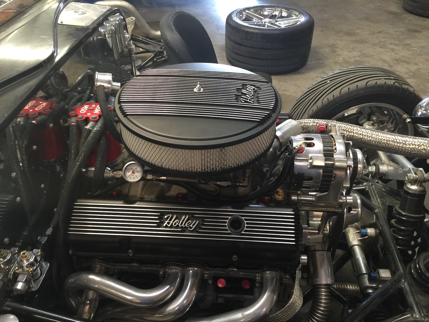 Holley Dress up accessories set off the engine polished firewall.