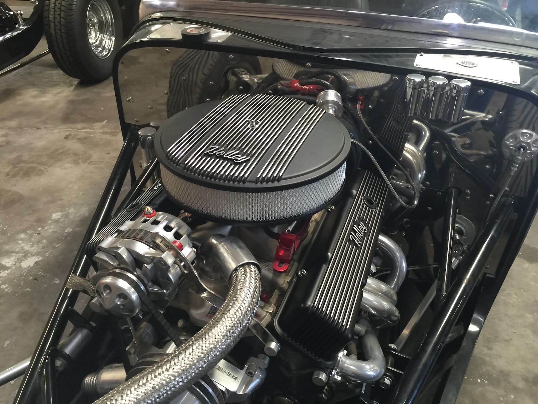 Holley Dress up accessories set off the engine polished firewall.