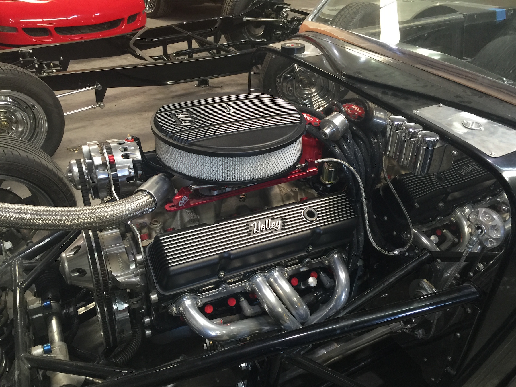 Holley Dress up accessories set off the engine polished firewall.