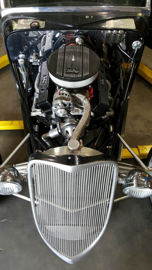 Holley Dress up accessories set off the engine polished firewall.