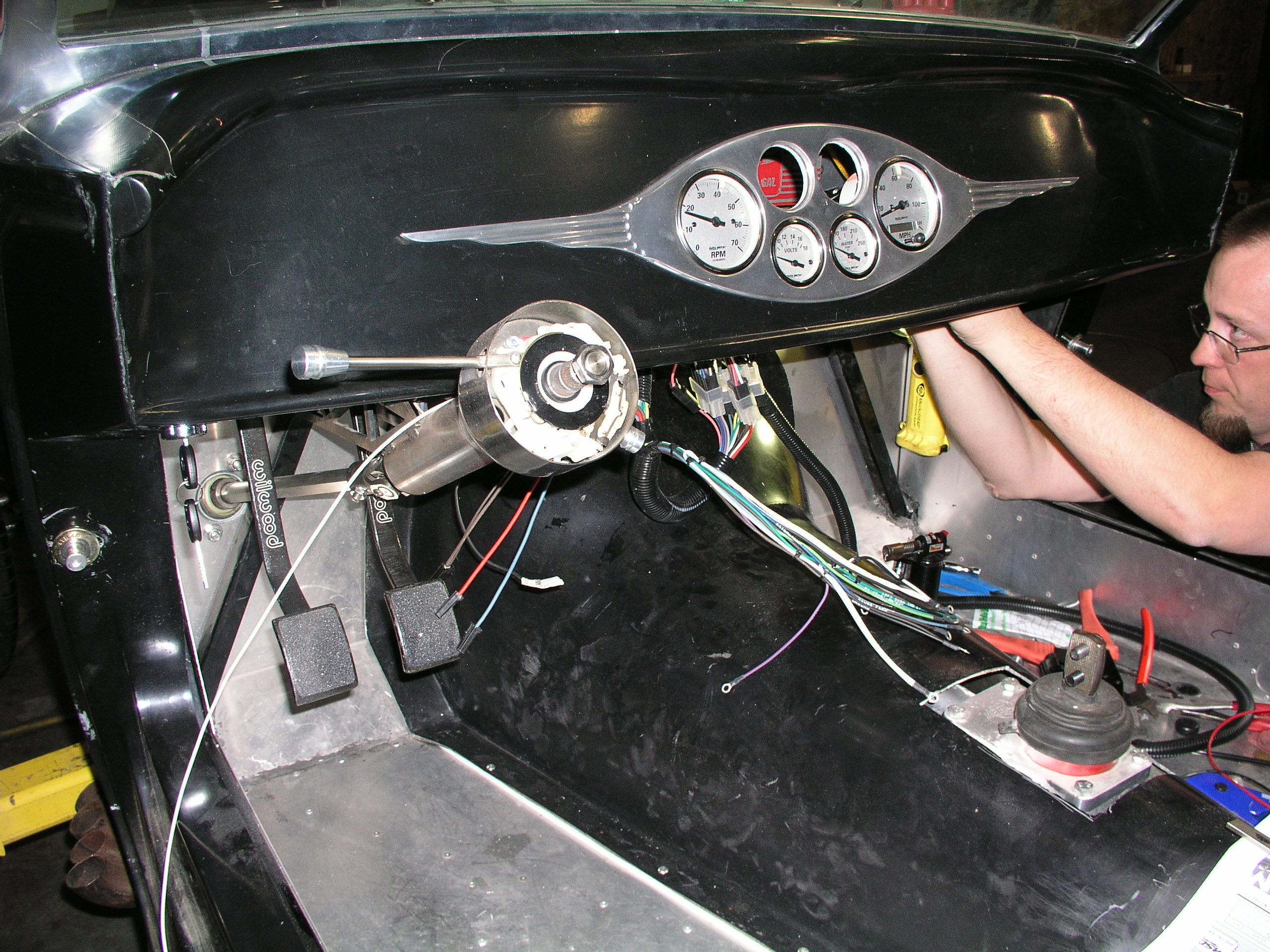 Steve Addison of SNL Performance and Monster Clutch Company installs the initial wiring in the car