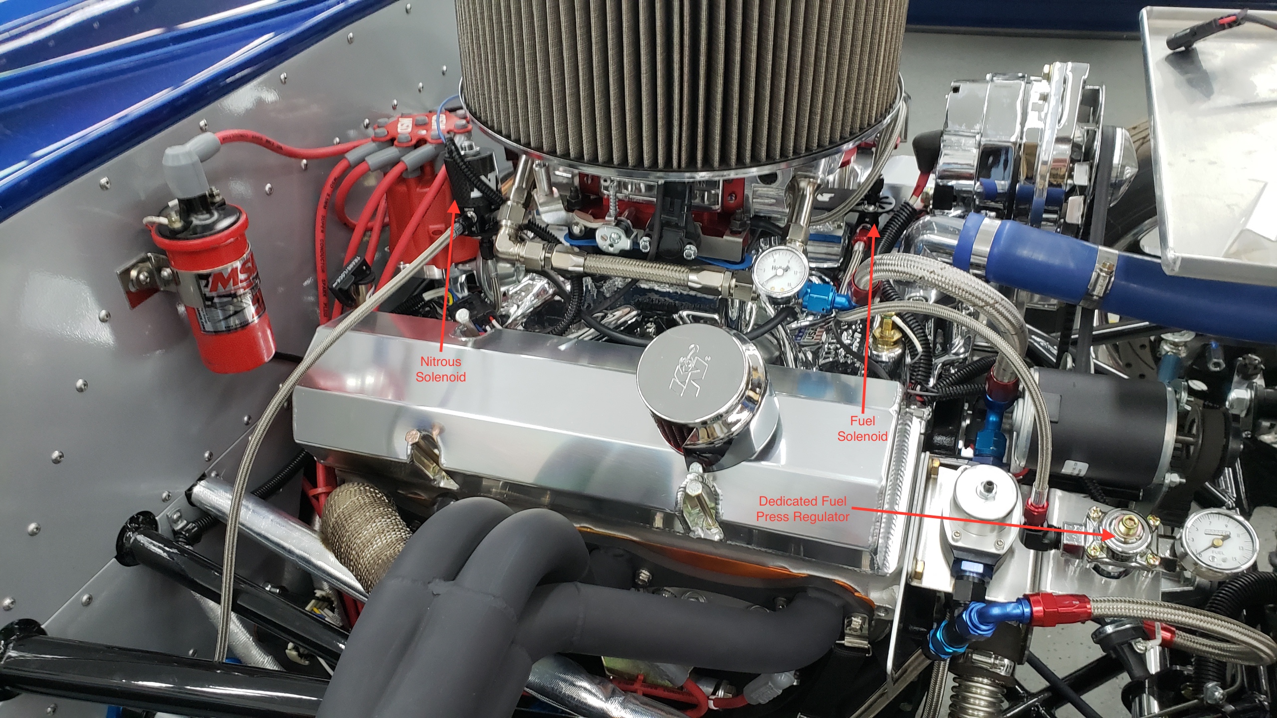 While waiting for the 2019 racing season to start I decided to complete the install of my nitrous system.  Of course as soon as it was ready to test we get hit with two snow storms and sub freezing temps that won't allow the ice and snow to melt.

This is a Nitrous Express Stage 6 plate system capable of adding 300 horsepower with a single stage.  It's operated with a sophisticated progressive controller.  

The engine makes 550 sea level HP and with a 100-shot that works out to ~650-HP.  

Probably won't use more than 150-shot as the torque in 1st gear is within just a couple thousand lb ft of the rating of my 31-spline axles.  Would have to go to a spool and 35-spline axles to feel comfortable with more than 150-shot.

This engine was built with a GM truck block so ~700 HP and more than 700 lb ft of torque is really uncharted territory for my experience with a GM block.  I've read of folks running a GM block with that much (drag race only) but don't personally know anyone that has and got away with it.
