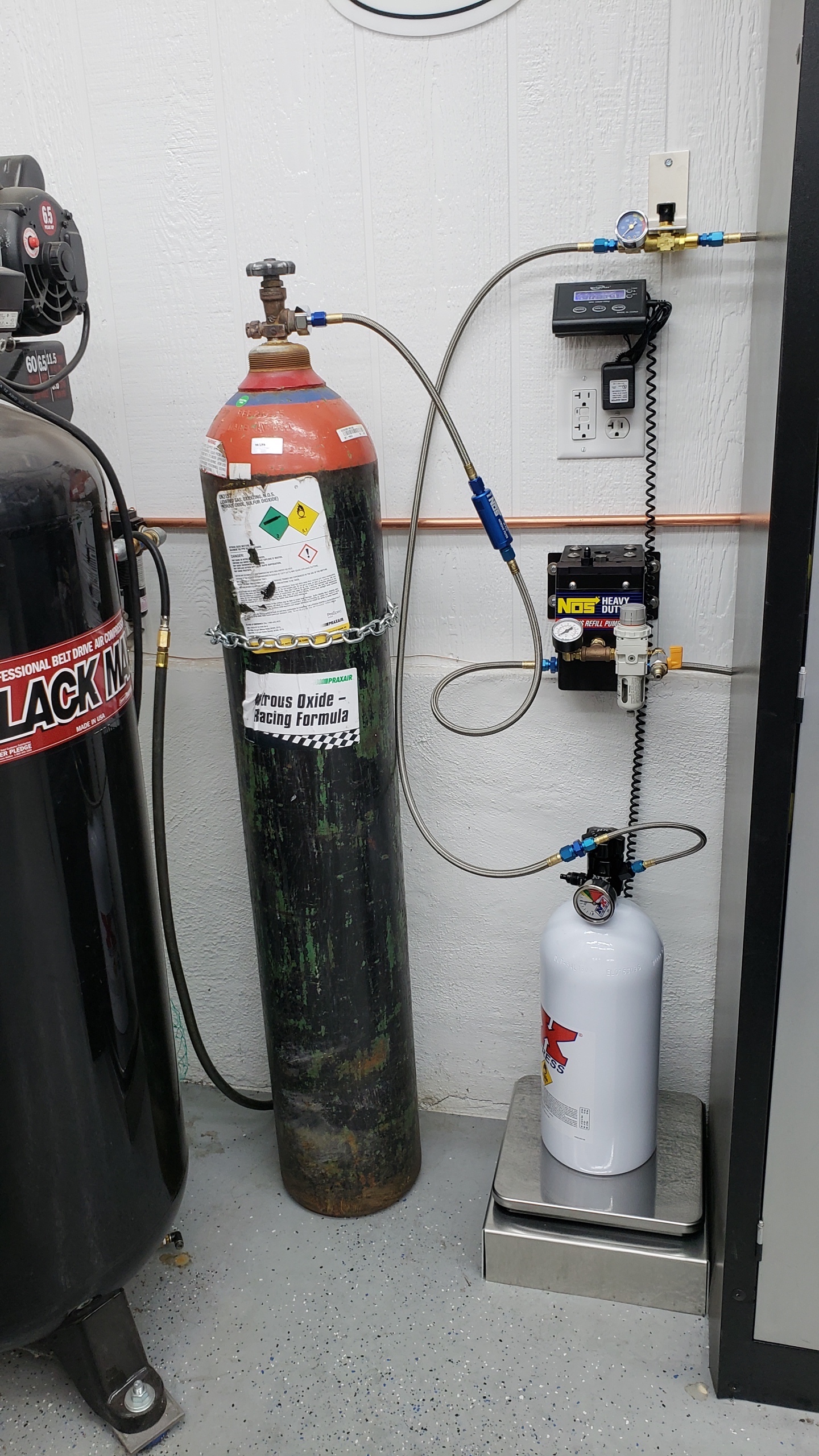 NOS fill station.  This is a very clean set-up and works well.  Not only is filling your own bottles less expensive but out here in the boonies there are no commercial filling stations.